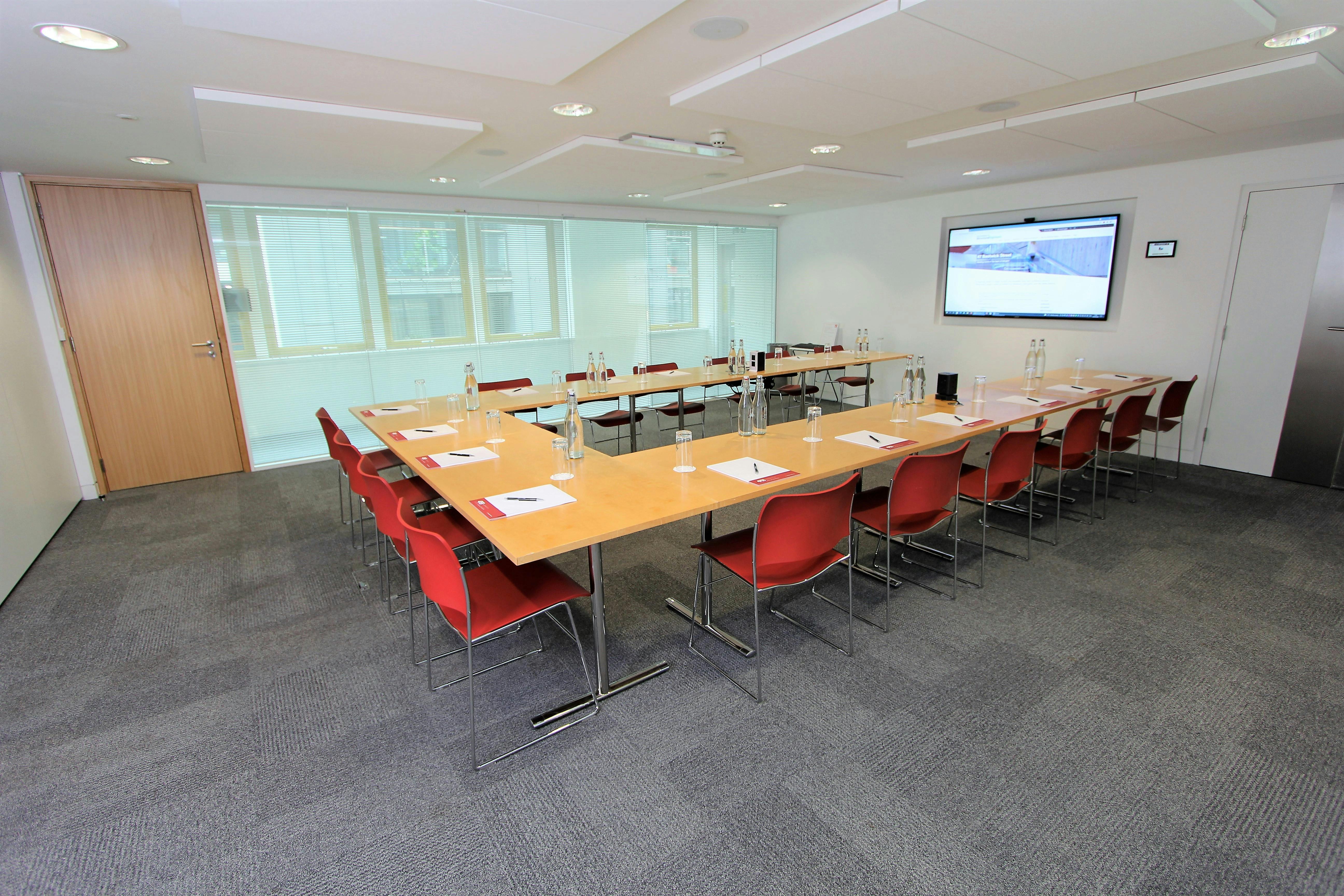 Meeting room at Bastwick 1 with long table, ideal for collaboration and presentations.
