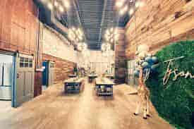 Stylish event space with rustic walls, ideal for corporate events and social gatherings.