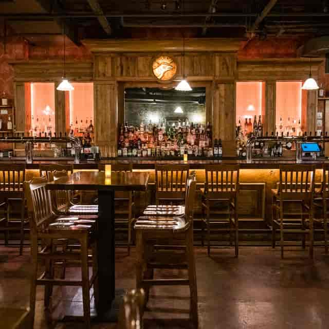 Cozy Crown Room bar with wooden decor, ideal for networking events and gatherings.