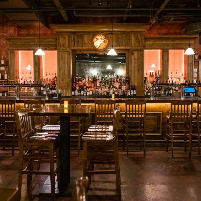 Cozy Crown Room bar with wooden decor, ideal for networking events and gatherings.