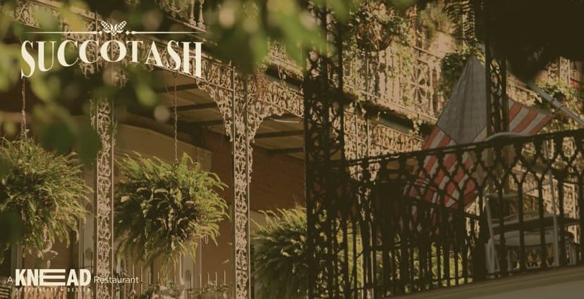 Charming outdoor venue with ironwork at Succotash Restaurant for elegant weddings and events.
