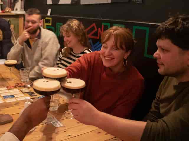 Lively networking event at Replay Bristol with attendees enjoying drinks and conversation.