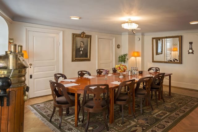 Elegant meeting room with wooden table, ideal for conferences in Stockholm.