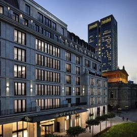 Modern hotel facade of Le Marais, Sofitel Frankfurt Opera, ideal for corporate events.