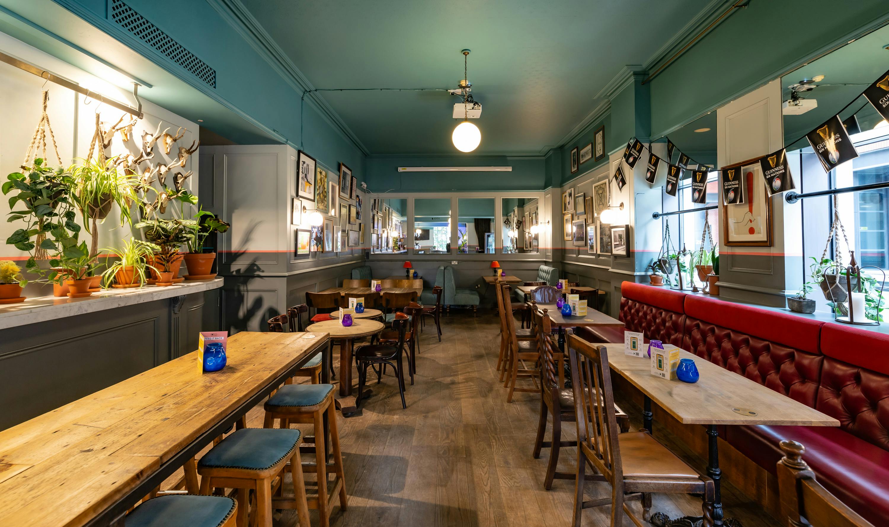 Cozy dining room with wooden tables, perfect for intimate gatherings and meetings.