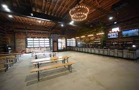 Rustic tea house venue with wooden benches for casual gatherings and events.