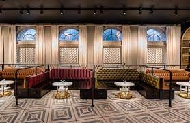 Stylish event space with plush seating, perfect for networking and intimate gatherings.