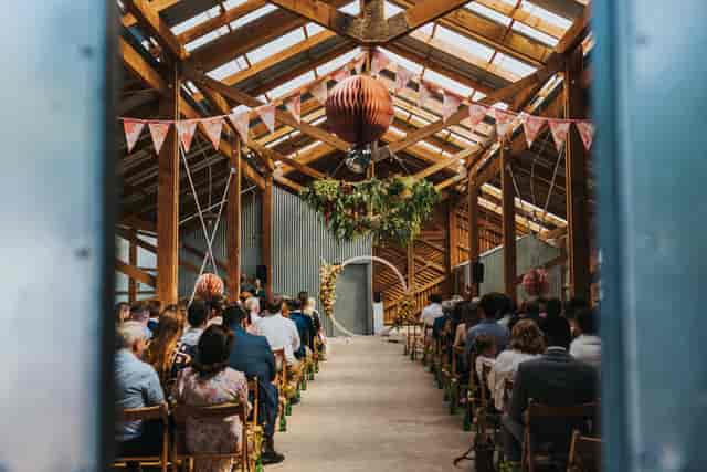 Rustic event space with wooden beams, ideal for weddings and gatherings at Oasis Farm Waterloo.