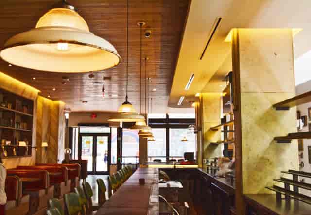 Stylish modern venue with warm lighting for intimate meetings and events in Crimson.