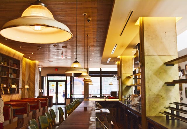 Stylish modern venue with warm lighting for intimate meetings and events in Crimson.
