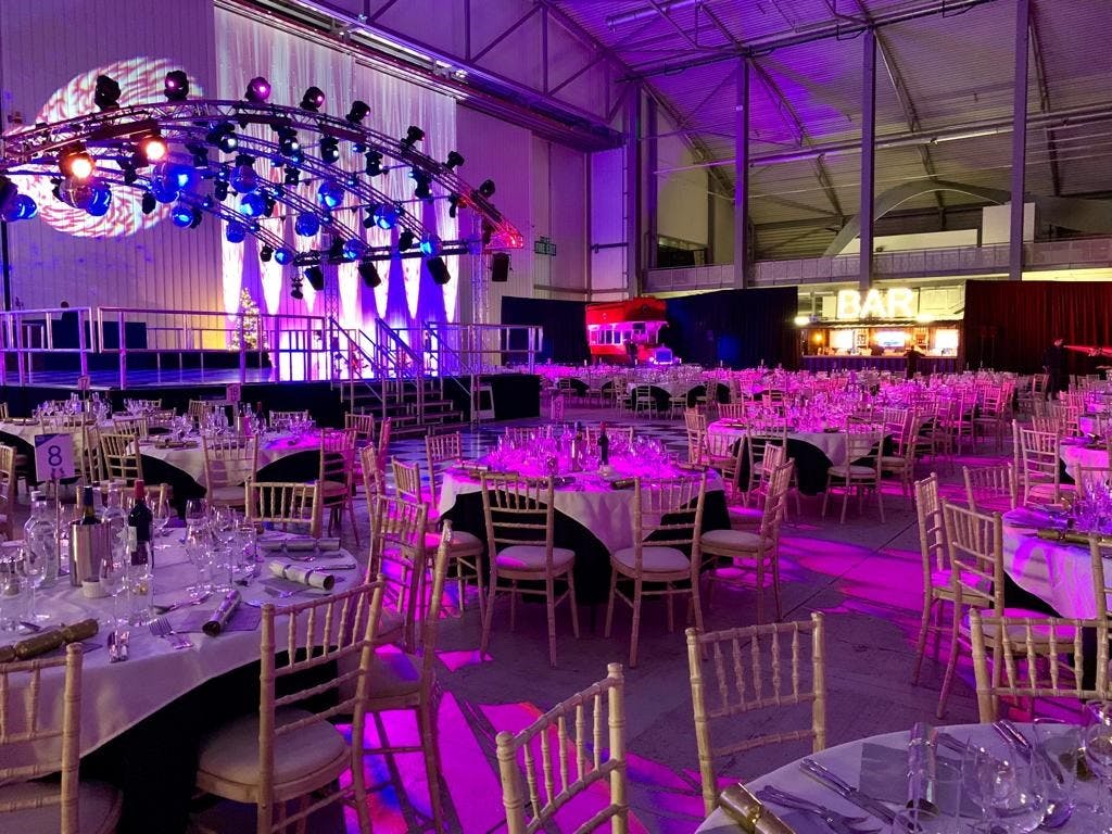 Conservation Hall at IWM Duxford, elegant dining setup for formal events and networking.