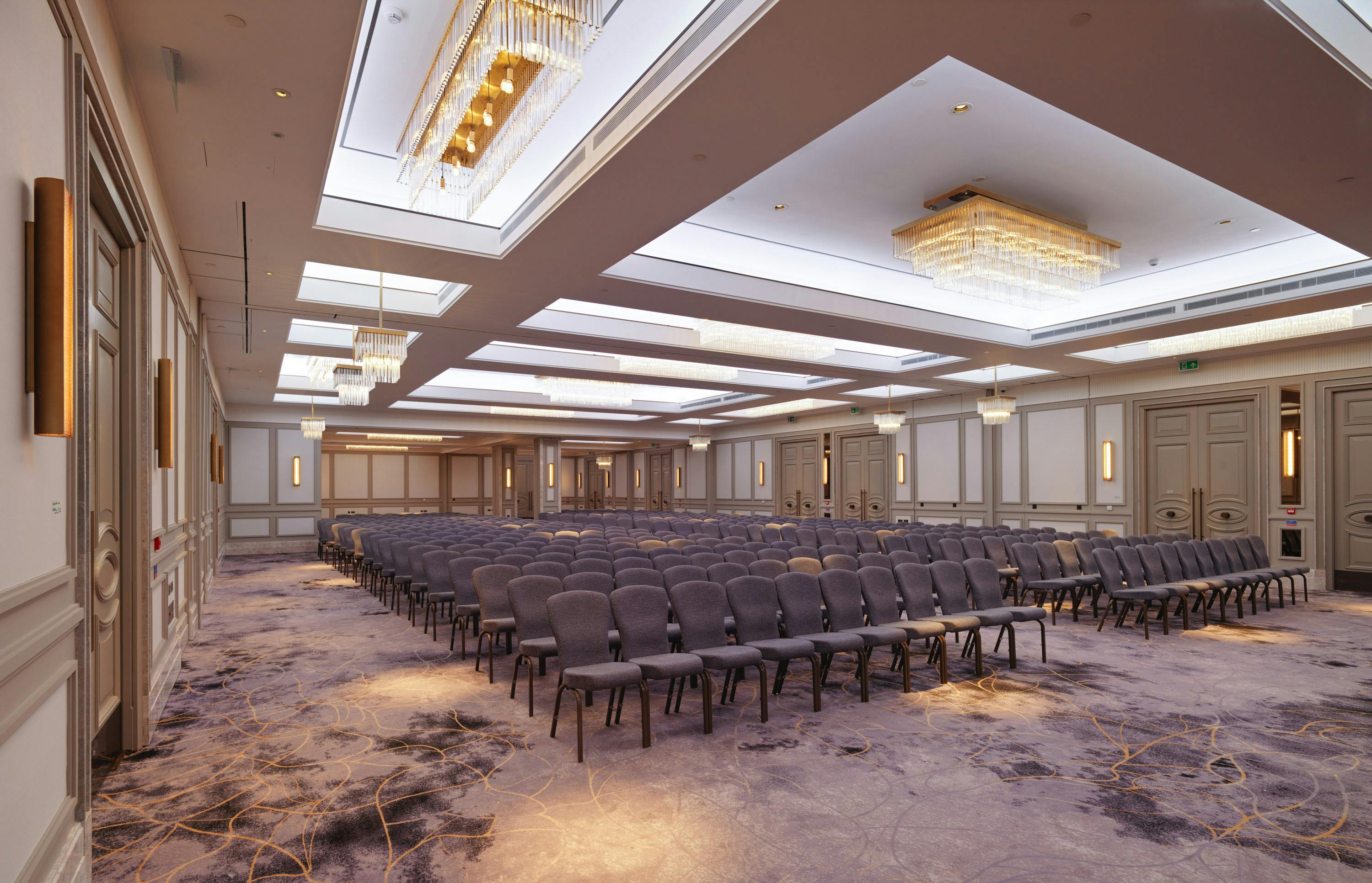 Elegant Biltmore Mayfair Ballroom with arranged chairs for conferences and presentations.