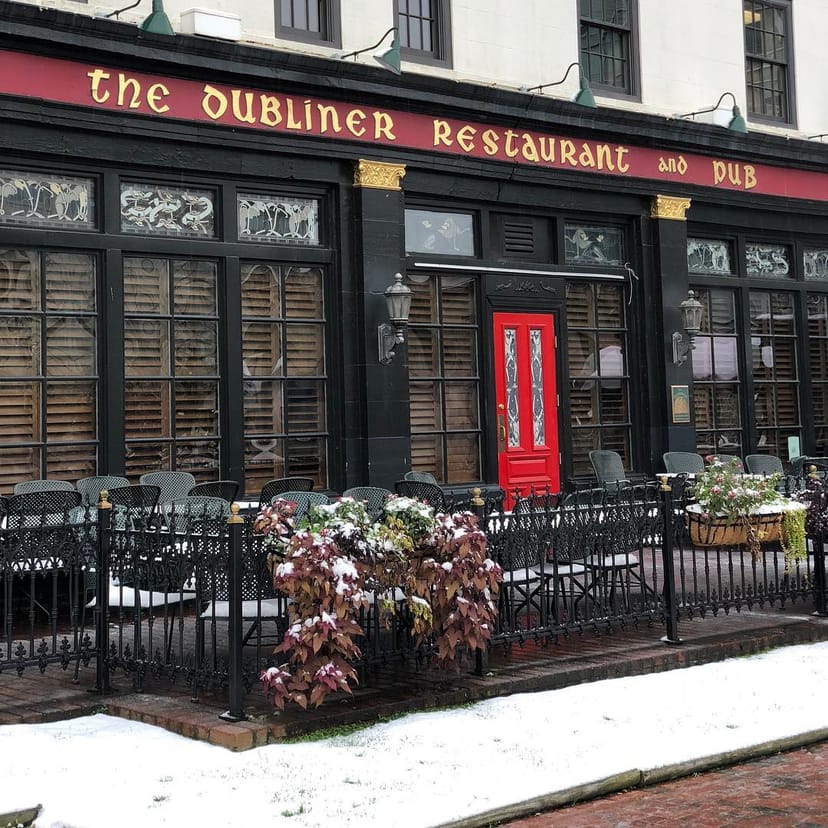 Charming pub with red door, ideal for networking events and team-building activities.