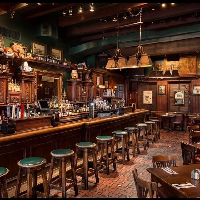 Warm wooden bar at The Presidents Bar, ideal for networking events and social receptions.
