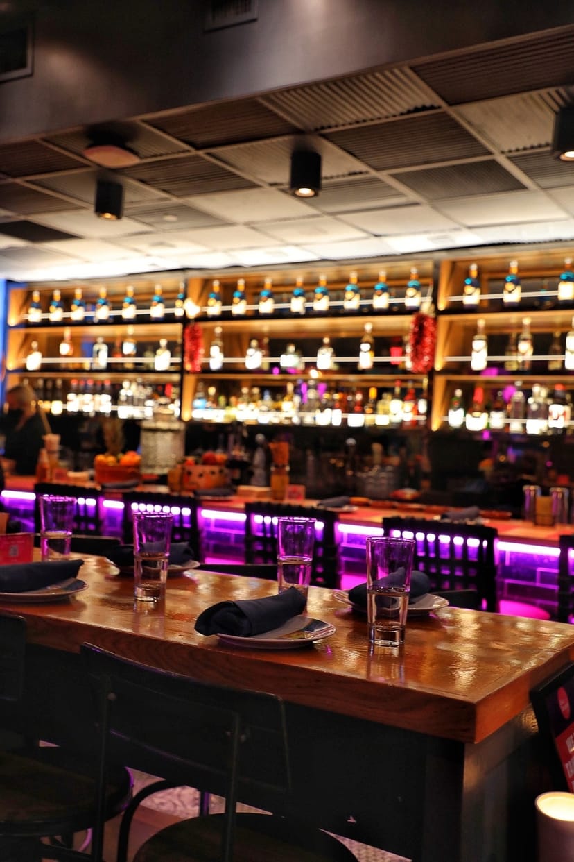 Vibrant bar setup in The Pomegranate Room, ideal for events and gatherings.