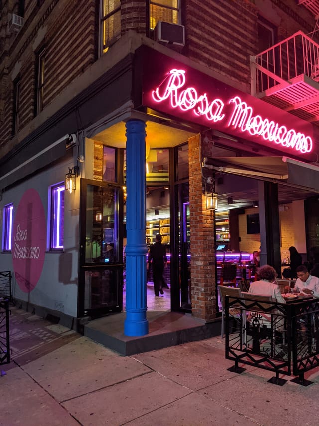 Vibrant Pomegranate Room at Rosa Mexicano DC, perfect for casual meetings and events.