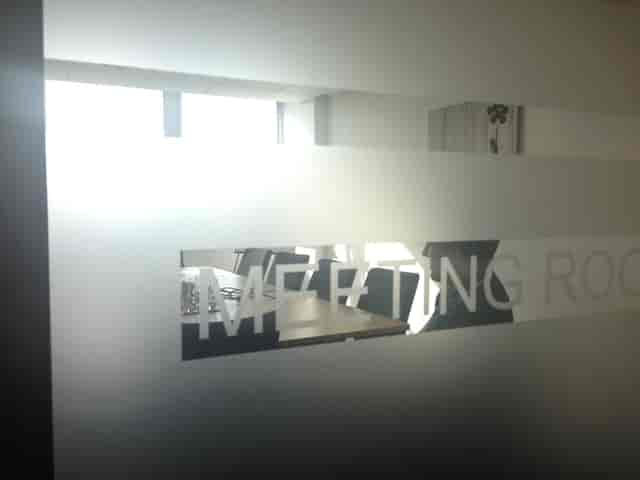 Meeting Room 1 at Reading Business Centre with frosted glass door for professional events.