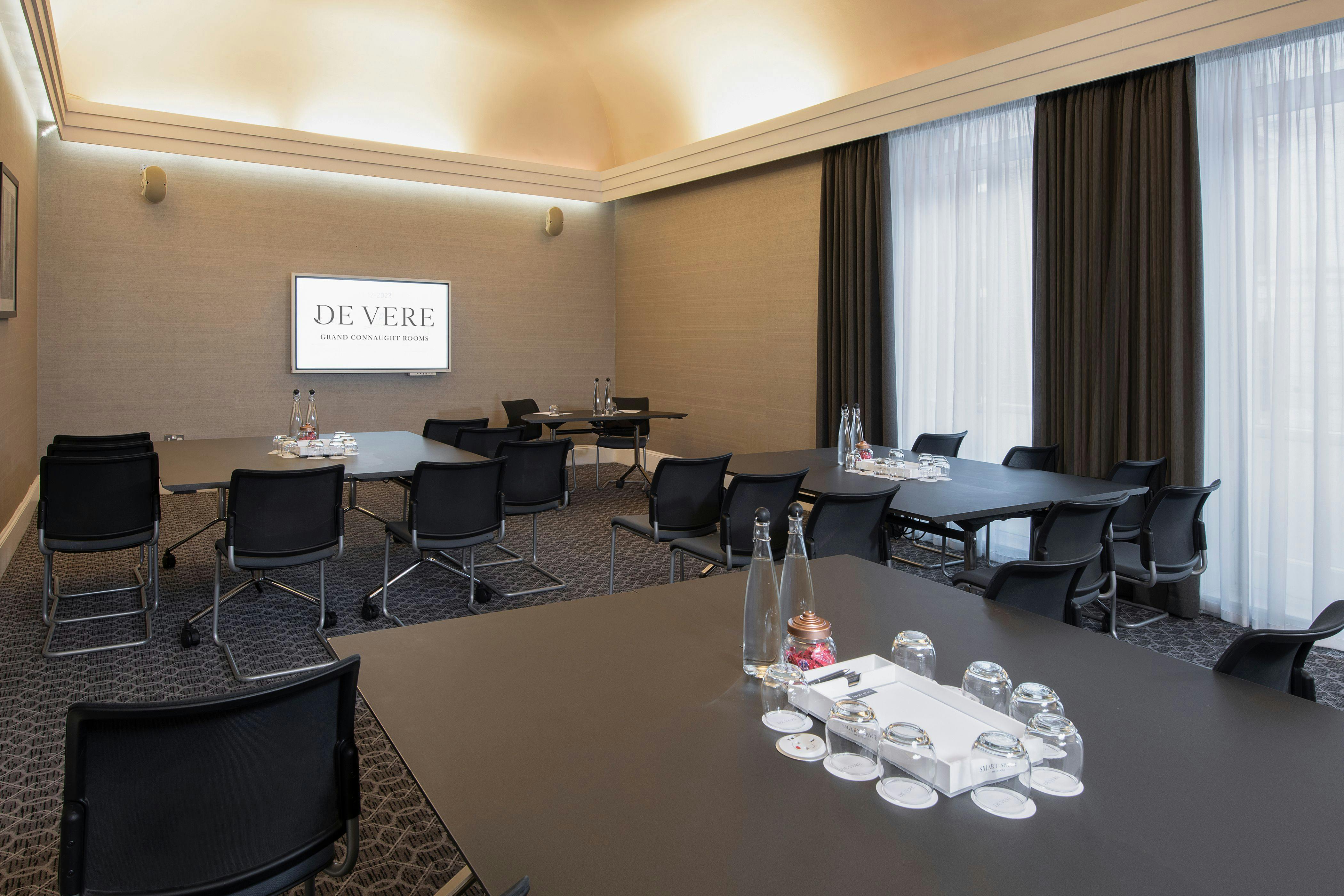 Oxford Suite meeting room with modern furnishings for professional events and presentations.