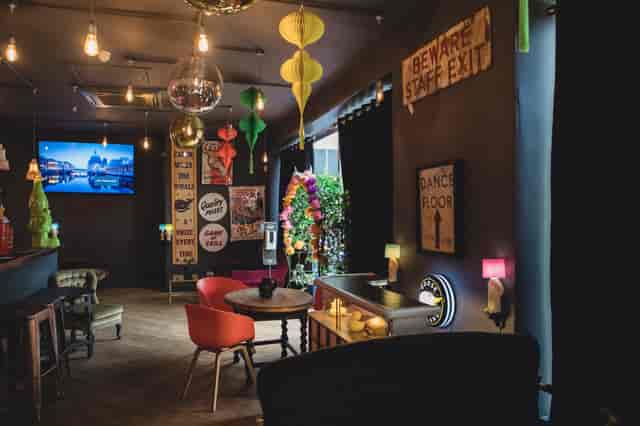 Vibrant Sobremesa Bar event space with colorful decor, ideal for networking and gatherings.
