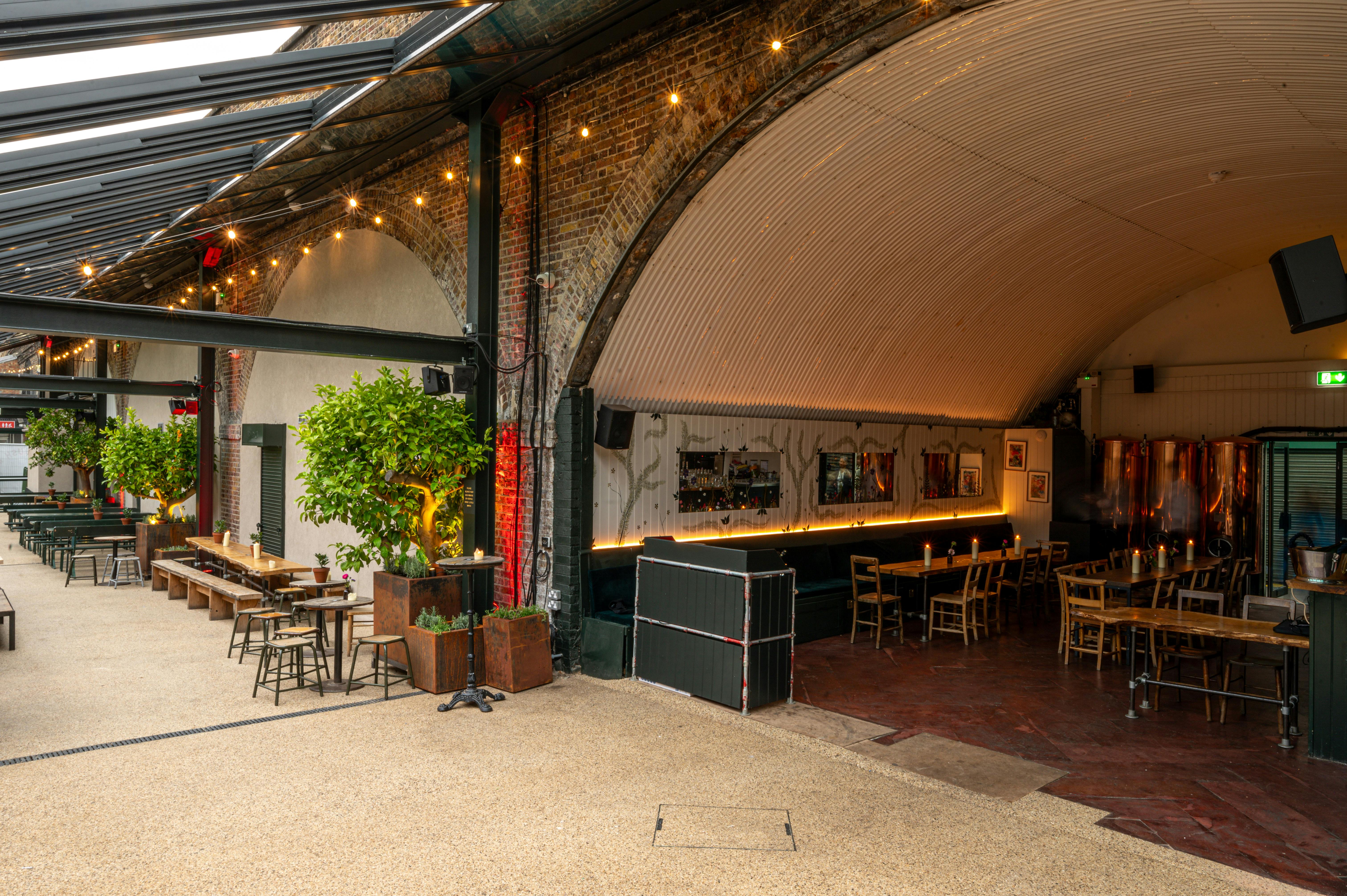 Bar area in The Hawk's Nest with exposed brick, ideal for networking events and receptions.