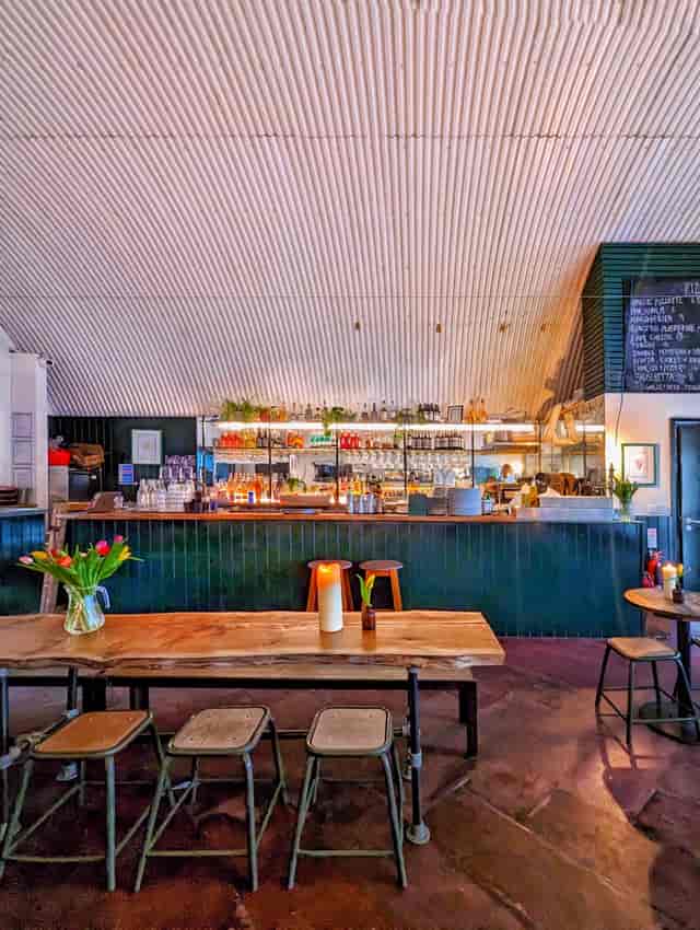 Stylish bar area in The Hawk's Nest, perfect for networking events and gatherings.