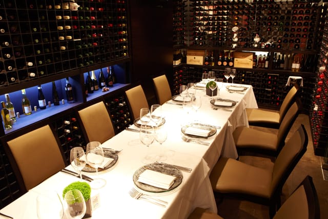 Elegant dining table in Benares wine cellar for corporate dinners and networking events.