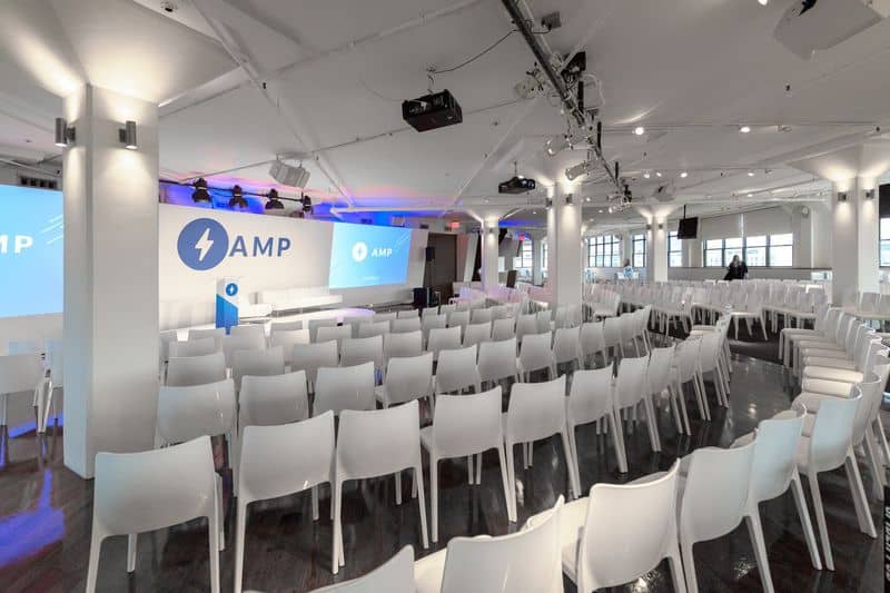 Tribeca 360 event space with white chairs, ideal for conferences and presentations.