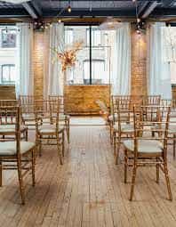 Elegant event space with wooden chairs, perfect for gatherings in Toronto.