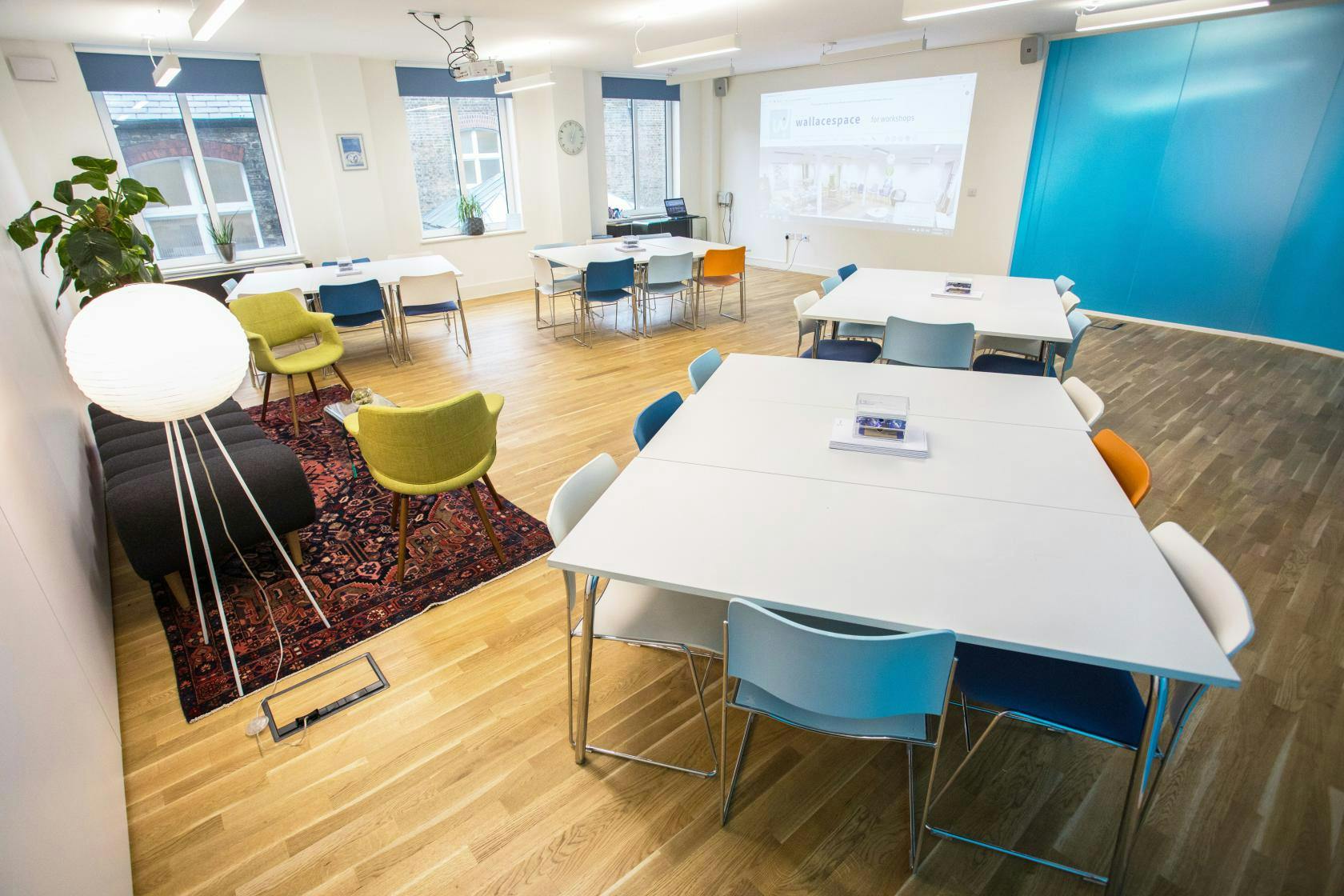 Modern meeting space with colorful seating for collaboration and creativity events.