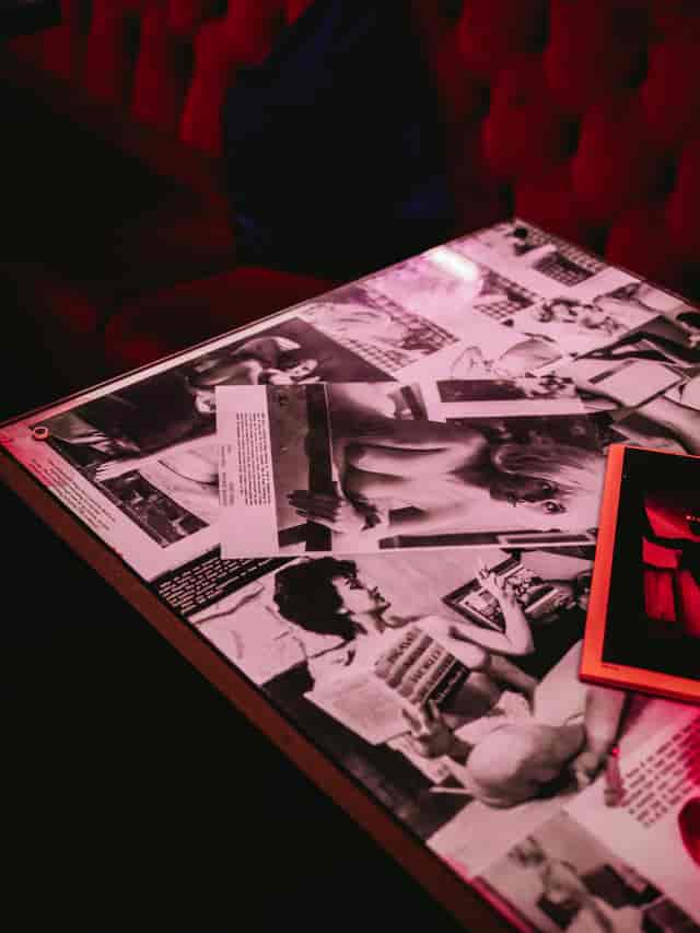 Mayfair Suite table with vintage photos, ideal for networking events and creative workshops.