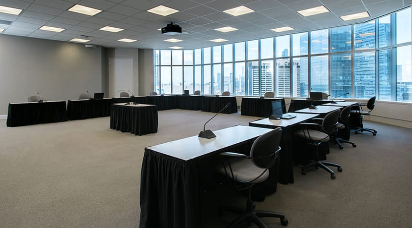 Inverness Room at Vantage Venues: modern meeting space with U-shaped tables and city views.