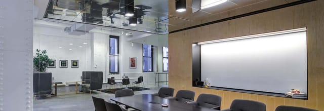 Modern meeting space at Convene 101 Greenwich St, NYC with glass walls for collaboration.