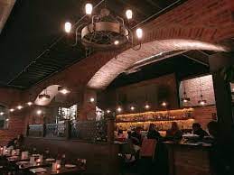 Main Dining Room at Agora DC: stylish venue with exposed brick, perfect for events.
