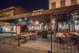 Charming outdoor dining space at night, perfect for casual gatherings and networking events.