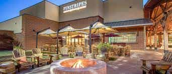 Outdoor event space at Pinstripes South Barrington with cozy seating and fire pit.
