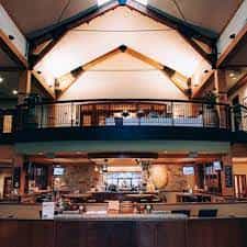 Spacious ballroom with vaulted ceiling for events and meetings at Pinstripes South Barrington.