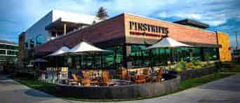 Vibrant outdoor seating at Buyout in Pinstripes, ideal for casual meetings and events.