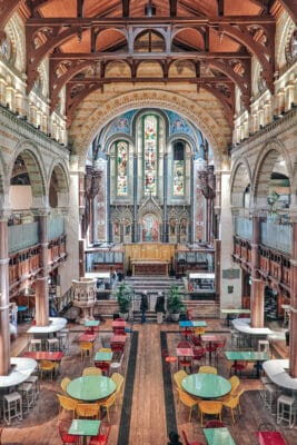 Elegant venue with vaulted ceilings and stained glass for events in Mercato Metropolitano.