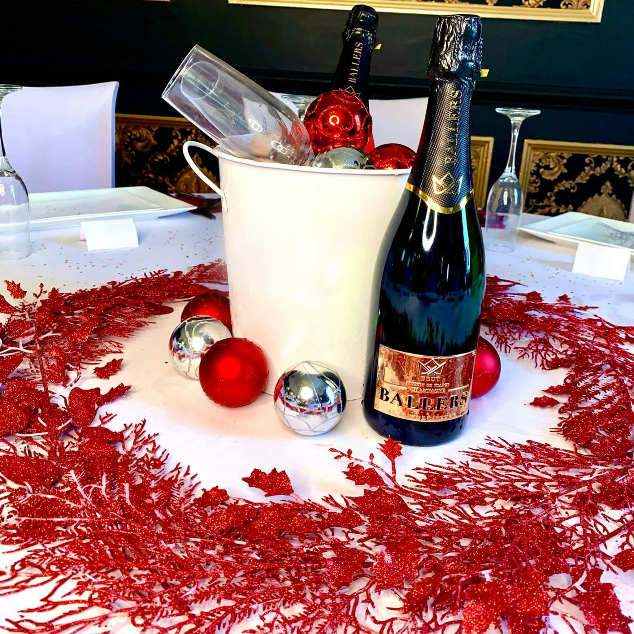 Festive ballroom table setting with champagne for holiday celebrations at The Garrison Tavern.
