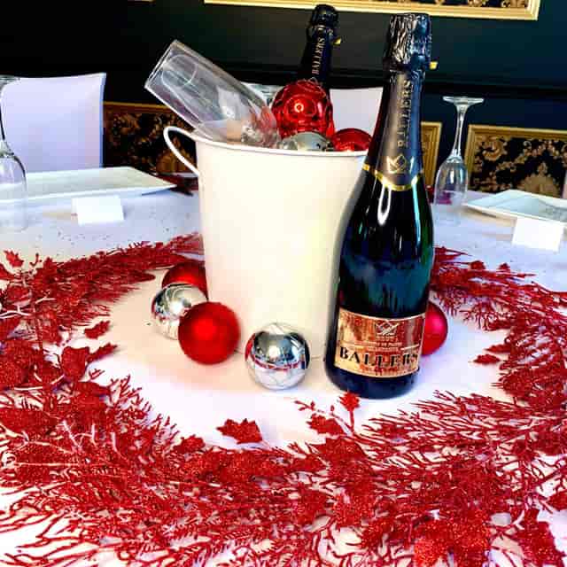 Festive ballroom table setting with champagne for holiday celebrations at The Garrison Tavern.