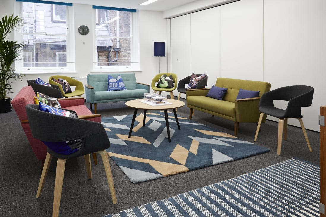 Modern lounge area with colorful seating for networking and informal meetings in Covent Garden.