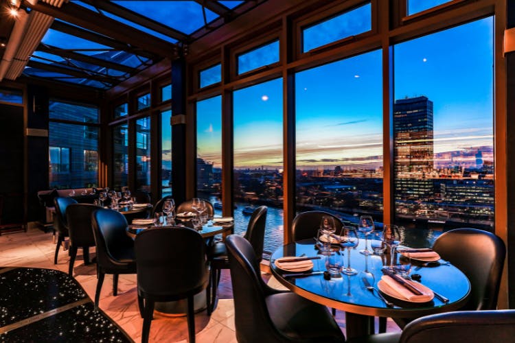 Elegant dining at Mezemiso Rooftop Restaurant with skyline view, perfect for upscale events.