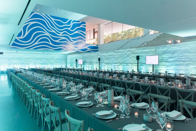 Elegant dining setup for corporate gala at San Francisco Museum of Modern Art.