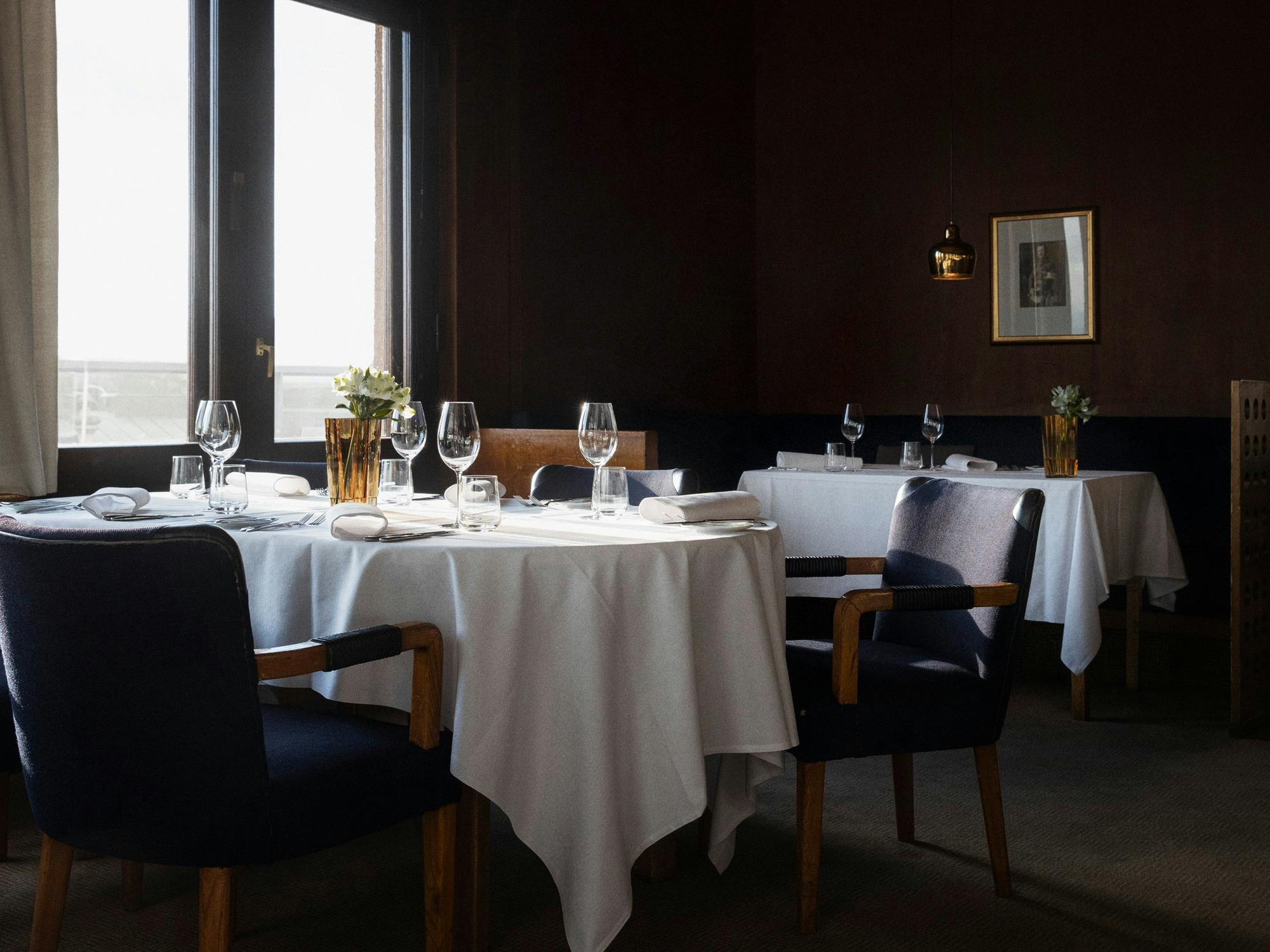 Elegant dining setup in Savoy Helsinki's private room for corporate dinners and gatherings.