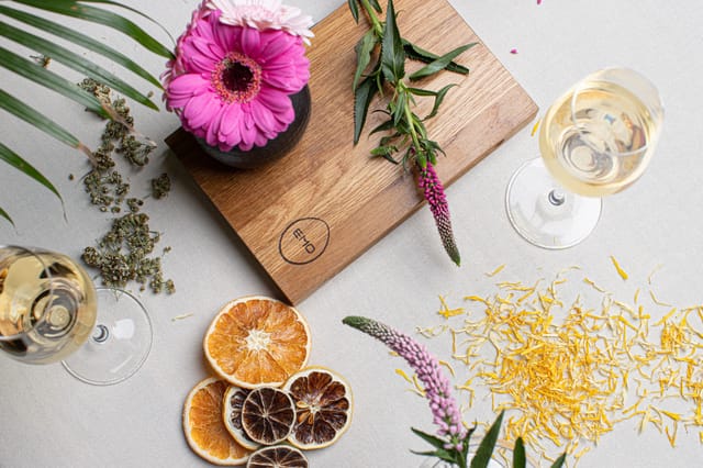 Elegant private dining room setup with glassware and floral accents for upscale events.