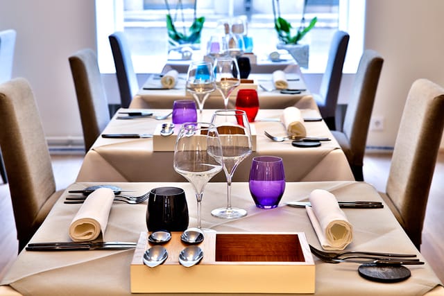 Private dining room at Ragú with elegant table settings for corporate events.