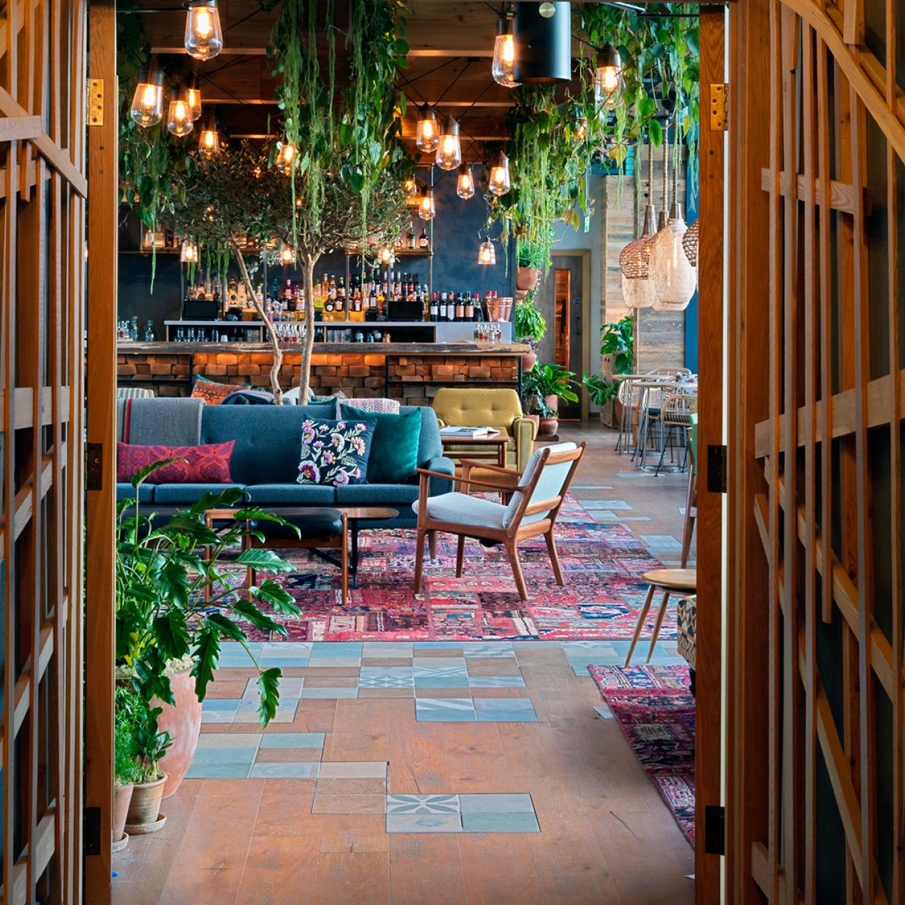 Vibrant Treehouse event space with cozy seating, ideal for networking and gatherings. - Banner