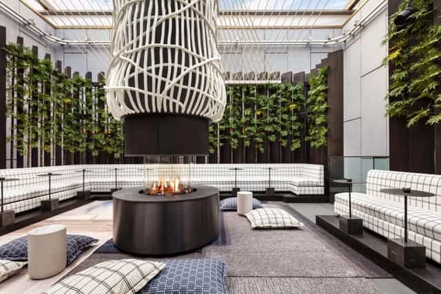 Izakaya Lounge bar area with fire feature, ideal for networking events and gatherings.