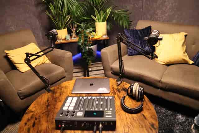 Cozy podcasting setup with professional audio equipment for intimate interviews.