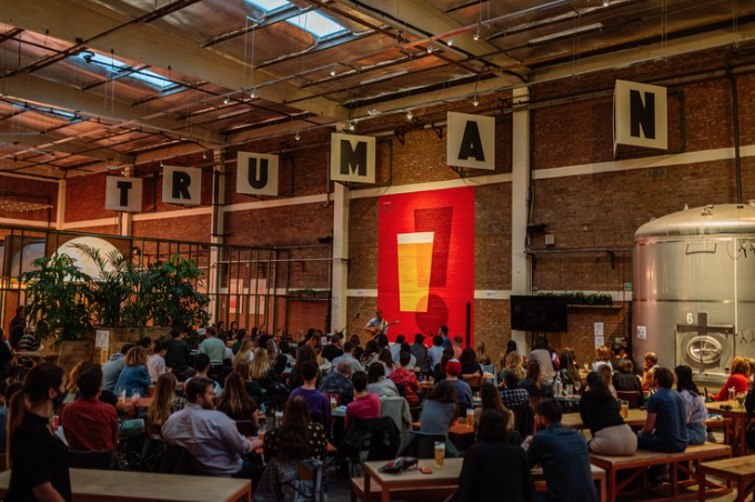 Vibrant event space at Big Penny Social with industrial decor for networking and gatherings. - Banner